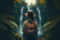 Woman in front of a waterfall in a tropical forest, adventure Royalty Free Stock Photo