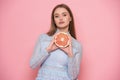 Woman fruit diet and healthy food eating concept. Girl holds grapefruit in hands.