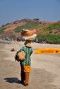 Woman fruit seller at beach