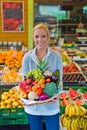 Woman at the fruit and vegetable market Royalty Free Stock Photo