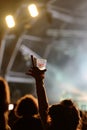 A woman full of joy with a glass of beer on his hand in a concert at Primavera Sound 2017