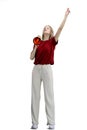 A woman, full-length, on a white background, with a megaphone Royalty Free Stock Photo