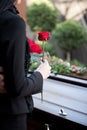 Woman at Funeral with coffin