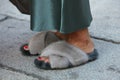 Woman with fur slippers and green solk dress before Max Mara fashion show, Milan Fashion Week street style