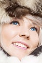 Woman in furs with blue contacts
