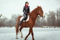 Woman galloping on horseback