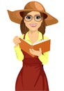 Woman with garden hat and glasses reading gardening journal