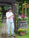 Woman in Garden With Landscaping Decorative Features