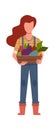 Woman gardener with harvest. Agricultural worker with vegetables, farmer girl holding wooden box, healthy eco fresh food