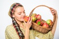 Woman gardener rustic style hold basket with apples white background. Woman sincere villager carry basket with natural Royalty Free Stock Photo