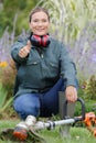 woman gardener smiling with thumb up