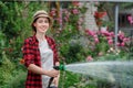 Woman gardener watering garden Royalty Free Stock Photo