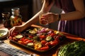 woman garnishing grilled veggies Royalty Free Stock Photo