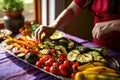 woman garnishing grilled veggies Royalty Free Stock Photo