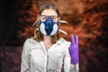 Woman in a gas mask shows an obscene gesture of coronavirus epidemic. Coronovirus Quarantine, Stay Home Concept. Covid-19 pandemic Royalty Free Stock Photo