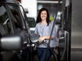 Woman at gas station Royalty Free Stock Photo