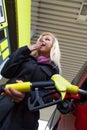 Woman at gas station to refuel Royalty Free Stock Photo