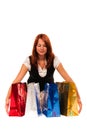 Woman gathering four colored bags Royalty Free Stock Photo