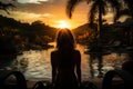 Woman gazing at phuket sunset from the pool, summer landscape image