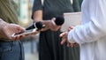 Woman gesticulating during interview with media, press conference, close-up