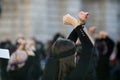 Woman gestures during a feminist flashmob in downtown Bucharest