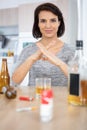 woman gestures that she will stop alcohol cigarettes