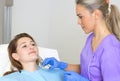 Woman Geting an Injection in her Lips in Beauty salon