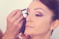 Woman geting make-up on