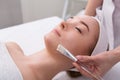Woman gets face mask by beautician at spa Royalty Free Stock Photo
