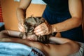 Woman gets professional head massage, close-up. Men`s hands doing massage of the scalp