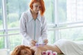 Woman getting anti-cellulite massage of back with use of vacuum cans in beauty studio Royalty Free Stock Photo