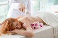 Woman getting anti-cellulite massage of back with use of vacuum cans in beauty studio Royalty Free Stock Photo