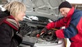 Woman getting a boost for her car Royalty Free Stock Photo