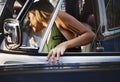 Woman Getting in a Car on Front Seat of The Car Road Trip Travel