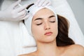 Woman getting cosmetic. injection. Beauty injections and cosmetology.  Young woman in beauty salon sloseup Royalty Free Stock Photo