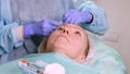 Woman getting cosmetic injection of botox, closeup. Woman in beauty salon. plastic surgery clinic Royalty Free Stock Photo