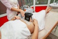 Woman getting cryolipolysis fat treatment in professional cosmetic cabinet Royalty Free Stock Photo