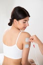 Woman getting electrodes therapy on hand Royalty Free Stock Photo