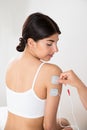 Woman getting electrodes therapy on hand