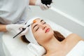 Woman getting face beauty treatment procedure in medical spa center Royalty Free Stock Photo