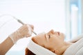 Woman getting face peeling procedure in beauty centre. Facial gas liquid peeling Royalty Free Stock Photo