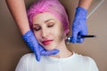 Woman getting facial massage with oxy air spray .oxygen therapy in spa salon.close up cheek face of patient Royalty Free Stock Photo