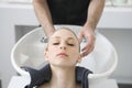 Woman Getting Hair Wash From Hairstylist In Salon Royalty Free Stock Photo