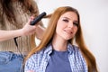 The woman getting her hair done in the beauty salon Royalty Free Stock Photo