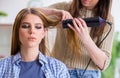 Woman getting her hair done in the beauty salon Royalty Free Stock Photo