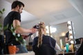 Woman getting her hair done in hair salon Royalty Free Stock Photo