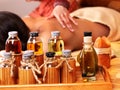 Woman getting massage in bamboo spa. Royalty Free Stock Photo