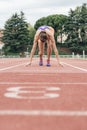 Woman getting ready to start running Royalty Free Stock Photo