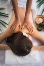 Woman getting spa body massage treatment at beauty spa salon