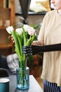 Woman getting spring flowers to event